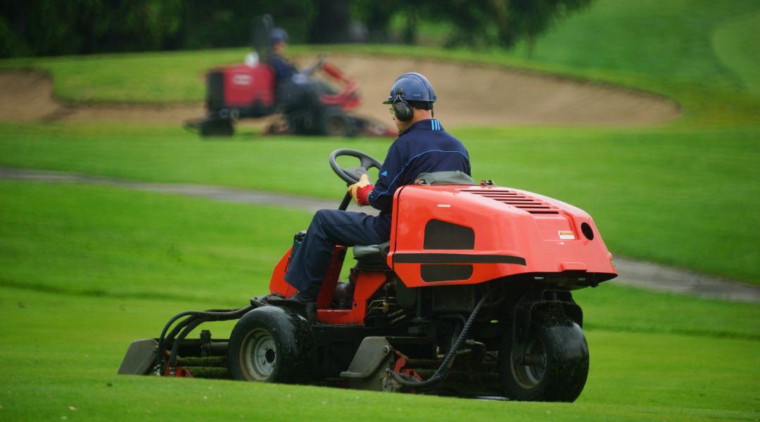 maintenance worker taking care of a golf course