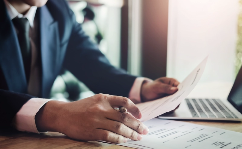 A hospitality worker filling out paperwork for a new job.